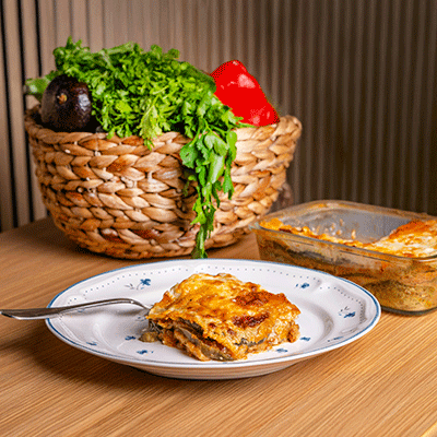 small piece of served lasagna on a plate